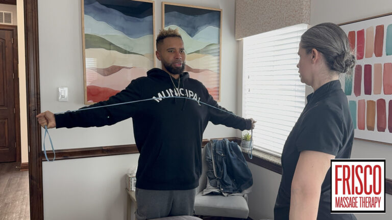 A man stands with arms outstretched, holding an exercise band, while a woman watches—demonstrating techniques often recommended as part of the best massage therapy for sports injuries. The “Frisco Massage Therapy” logo is in the bottom right corner.